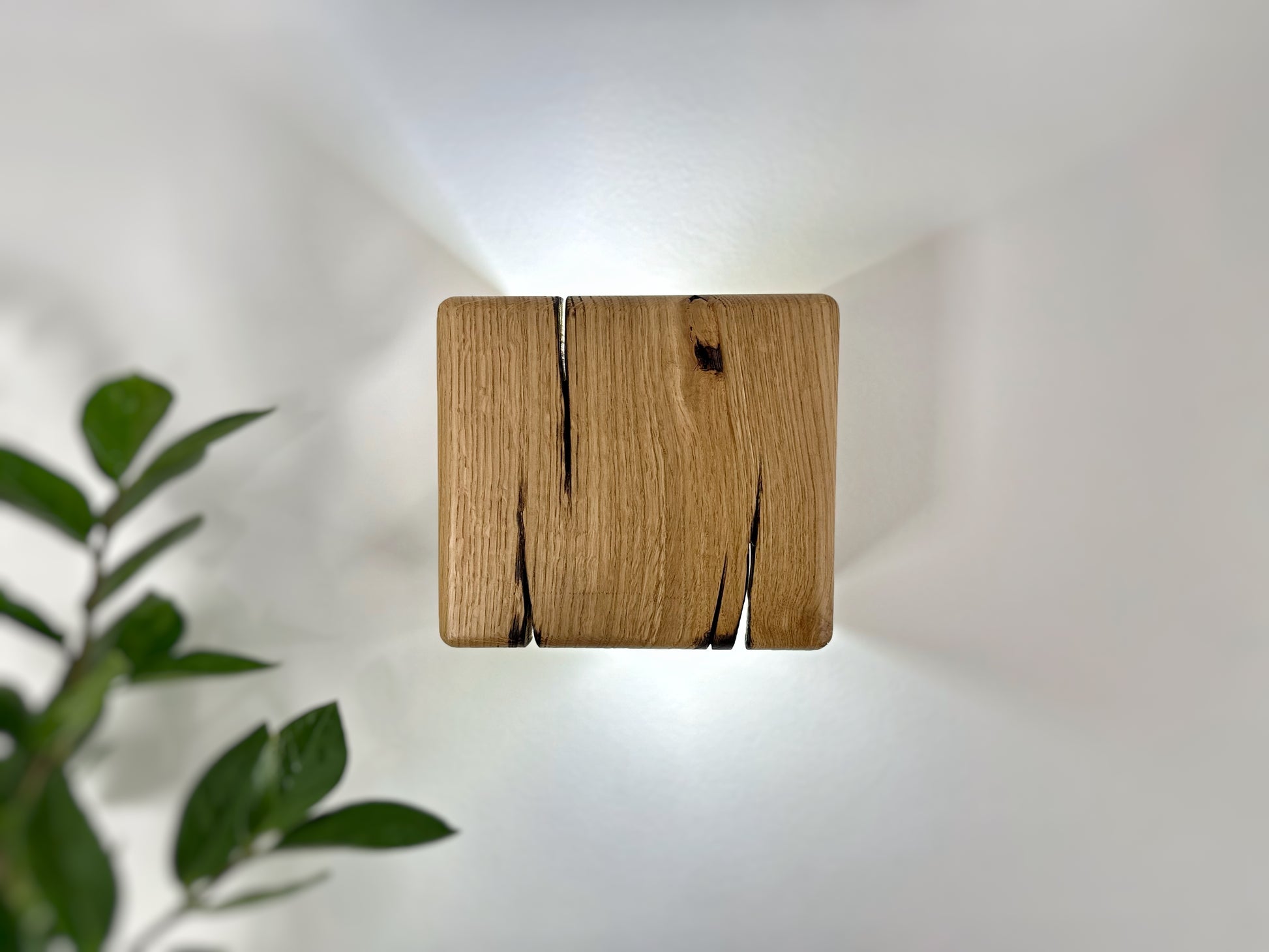 Modern rustic oak wood wall lights casting up and down light