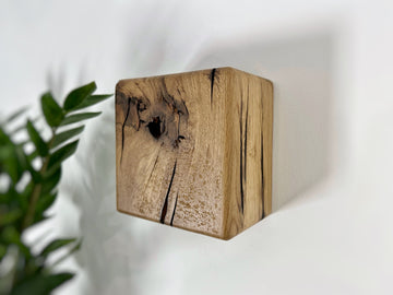 Modern rustic oak wood wall lights casting up and down light