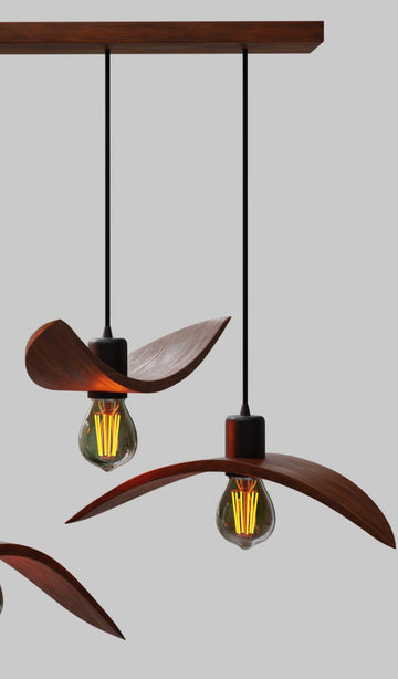 Sculptural 3-light linear wood chandelier resembling birds in flight
