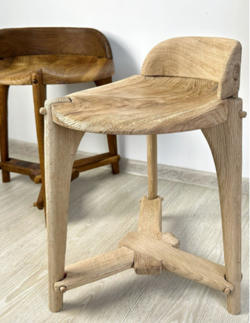 Handcrafted light oak counter stool with ergonomic saddle seat