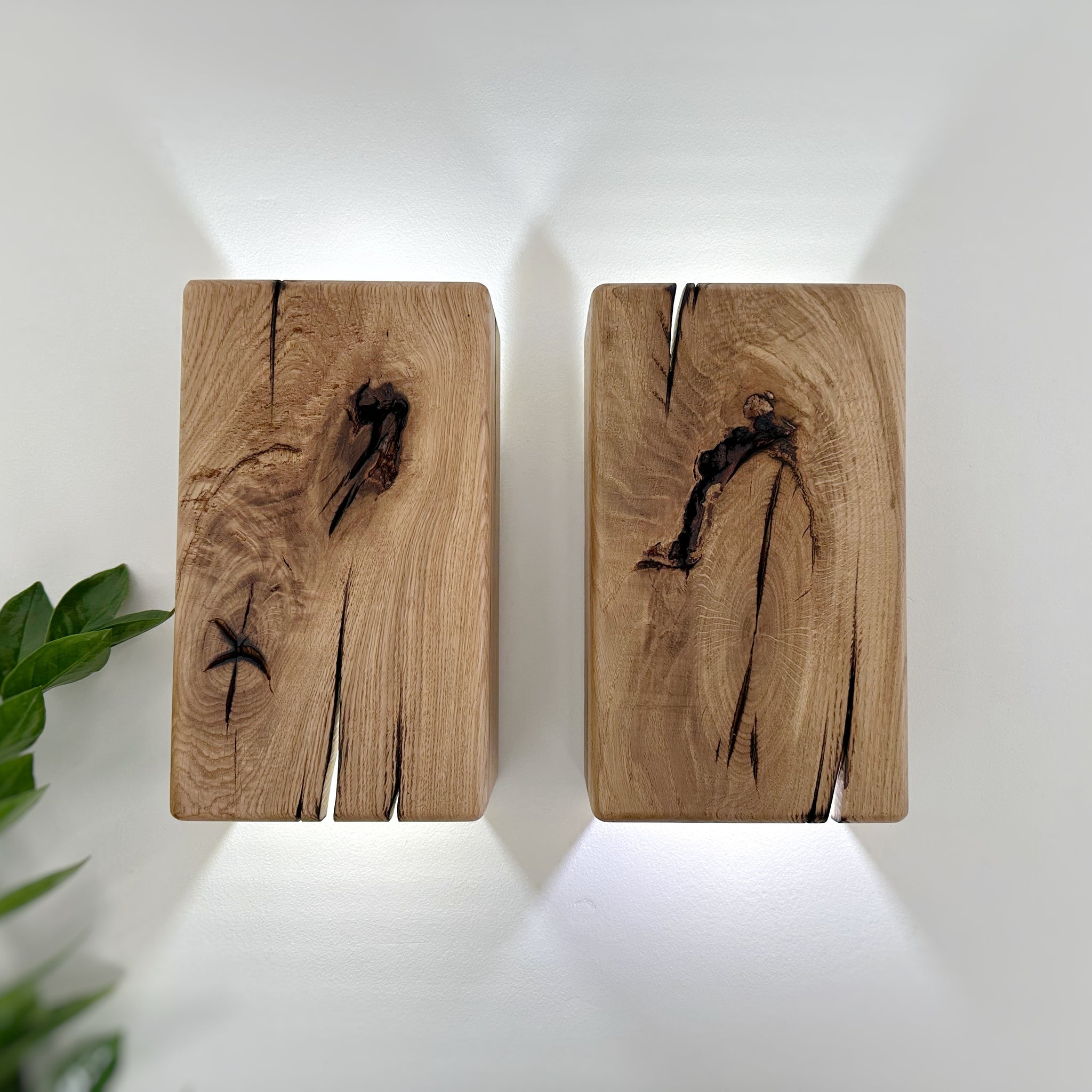 Modern rustic oak wood wall lights casting up and down light