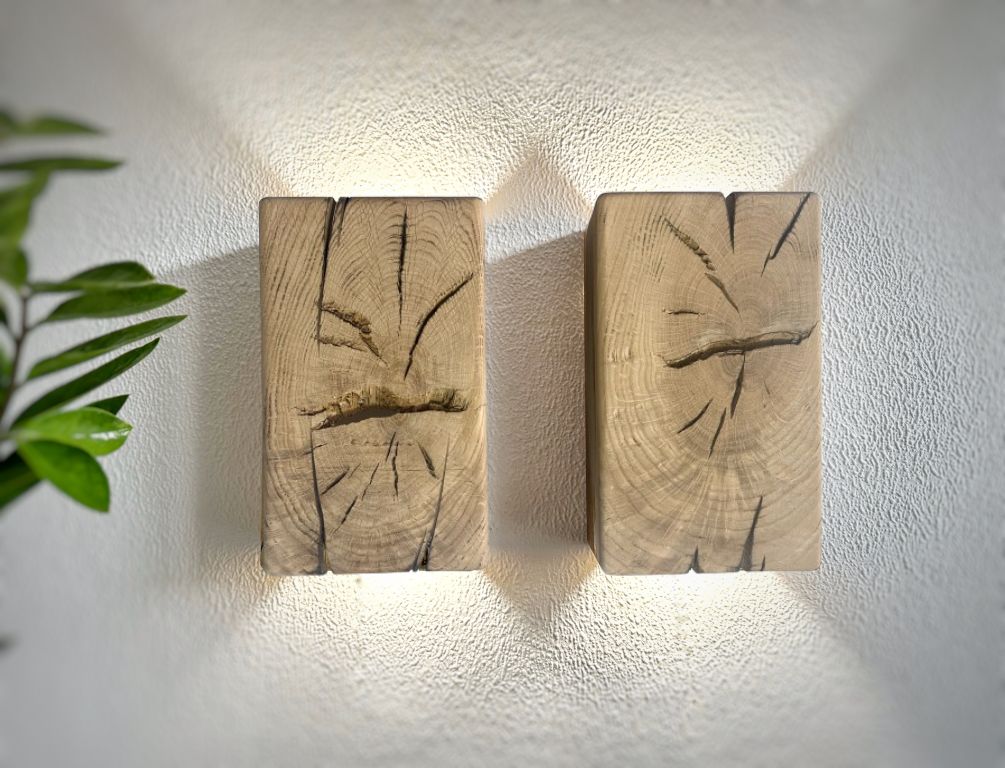 Modern rustic oak wood wall lights casting up and down light