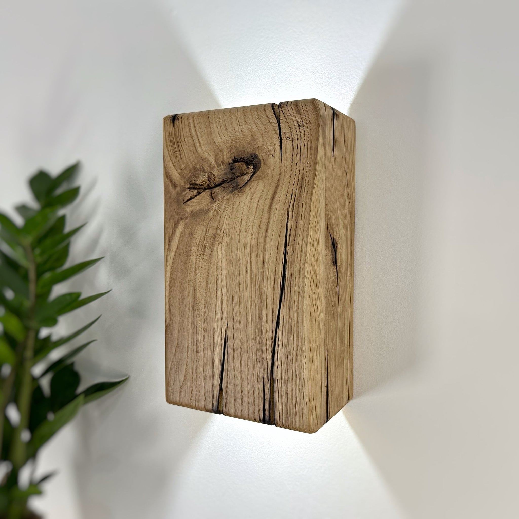 Modern rustic oak wood wall lights casting up and down light