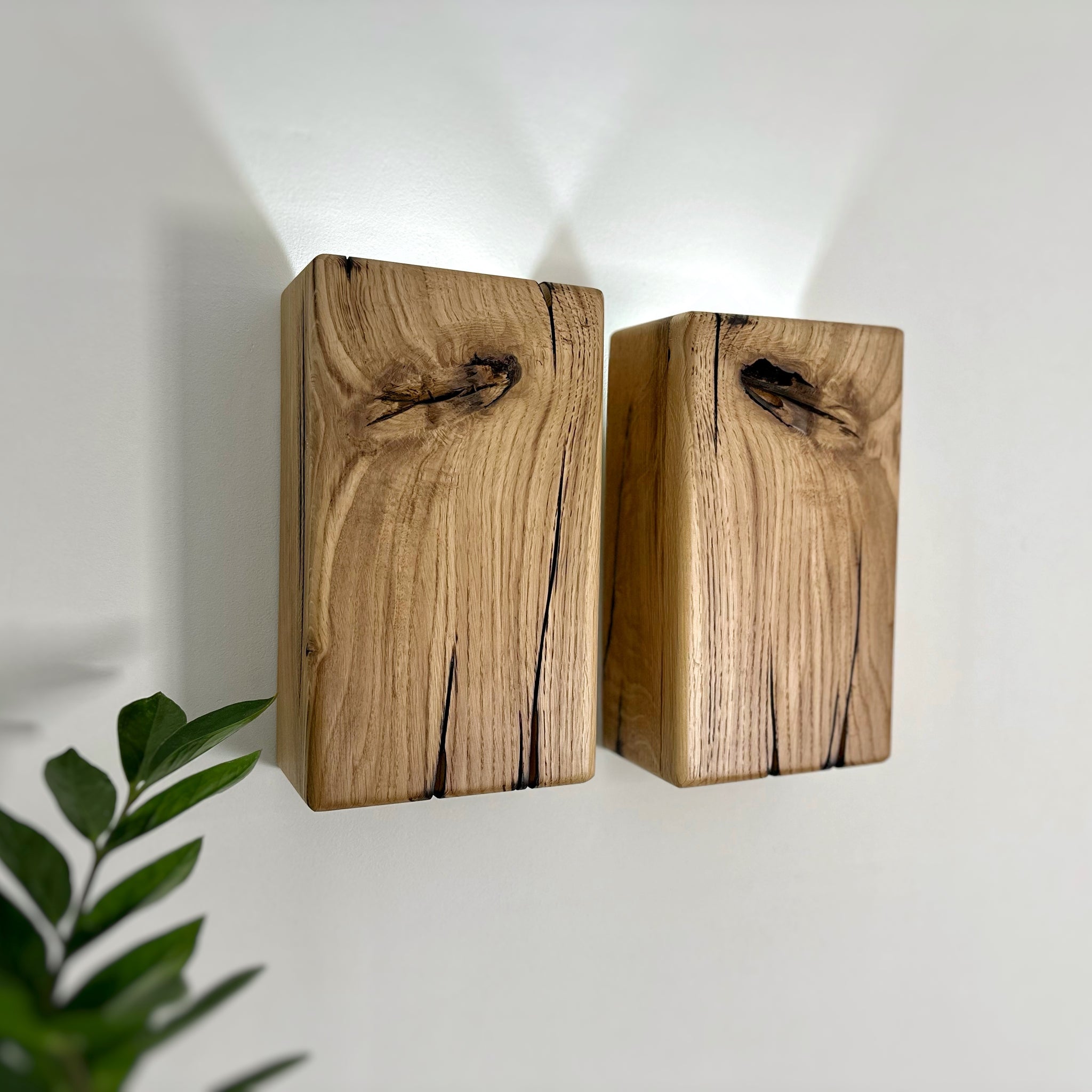 Modern rustic oak wood wall lights casting up and down light