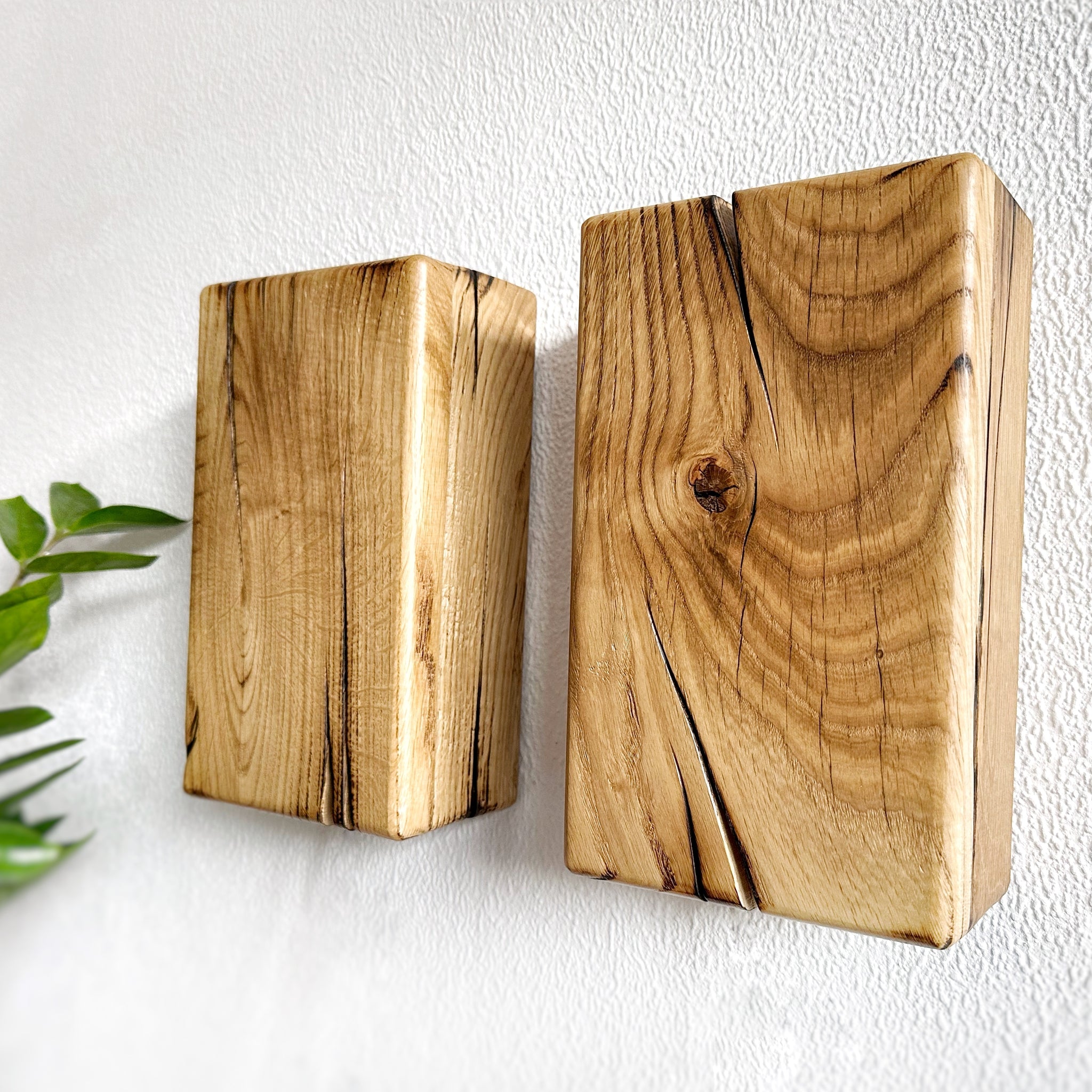 Modern rustic oak wood wall lights casting up and down light