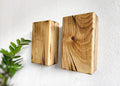 Modern rustic oak wood wall lights casting up and down light