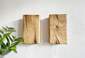 Modern rustic oak wood wall lights casting up and down light