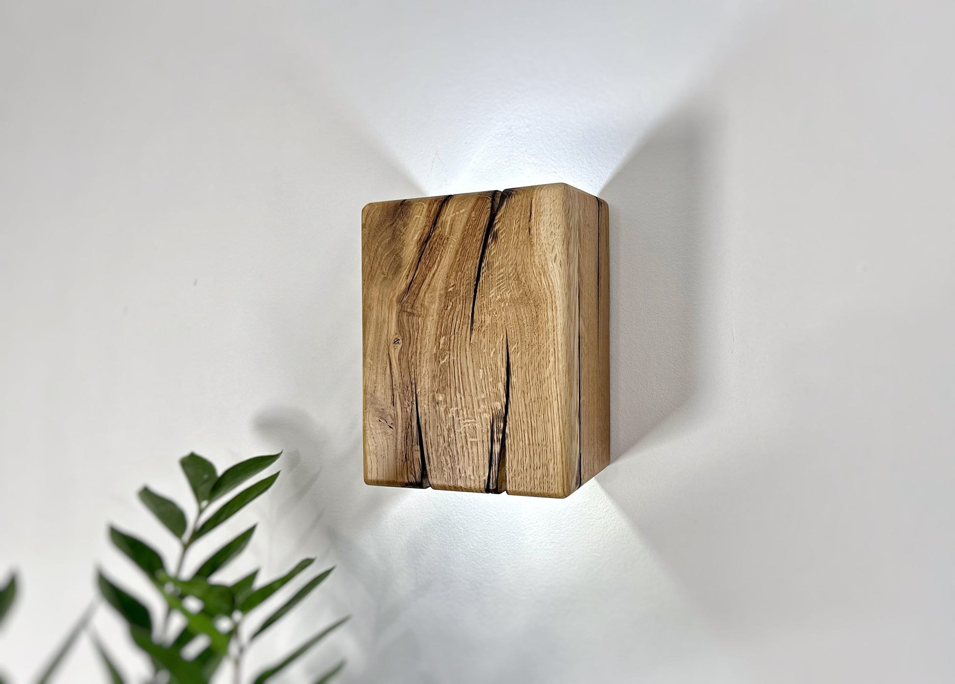 Rustic oak up-down wall sconce highlighting natural wood features