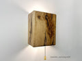 Modern rustic oak wood wall lights casting up and down light