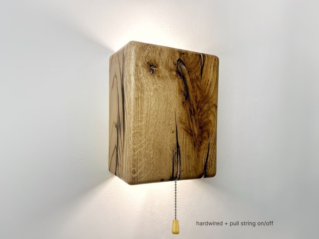 Modern rustic oak wood wall lights casting up and down light