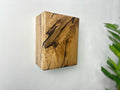 Modern rustic oak wood wall lights casting up and down light