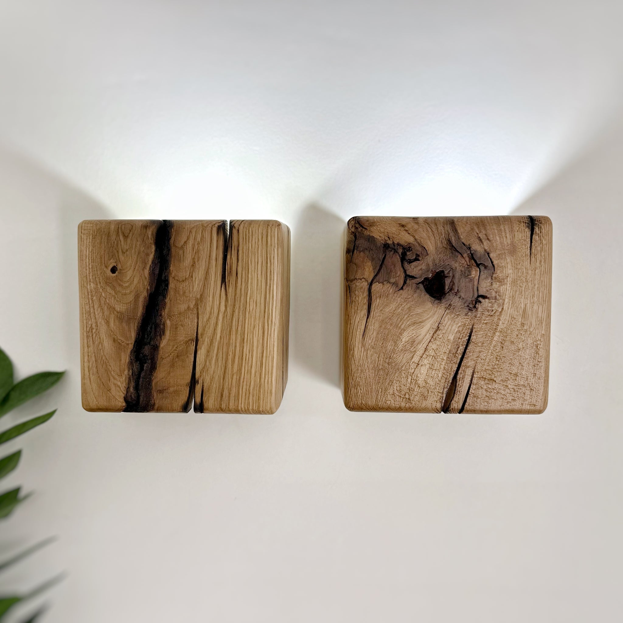 Modern rustic oak wood wall lights casting up and down light