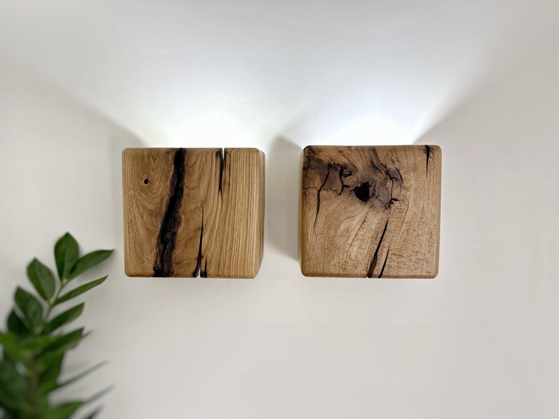 Modern rustic oak wood wall lights casting up and down light