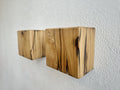 Modern rustic oak wood wall lights casting up and down light