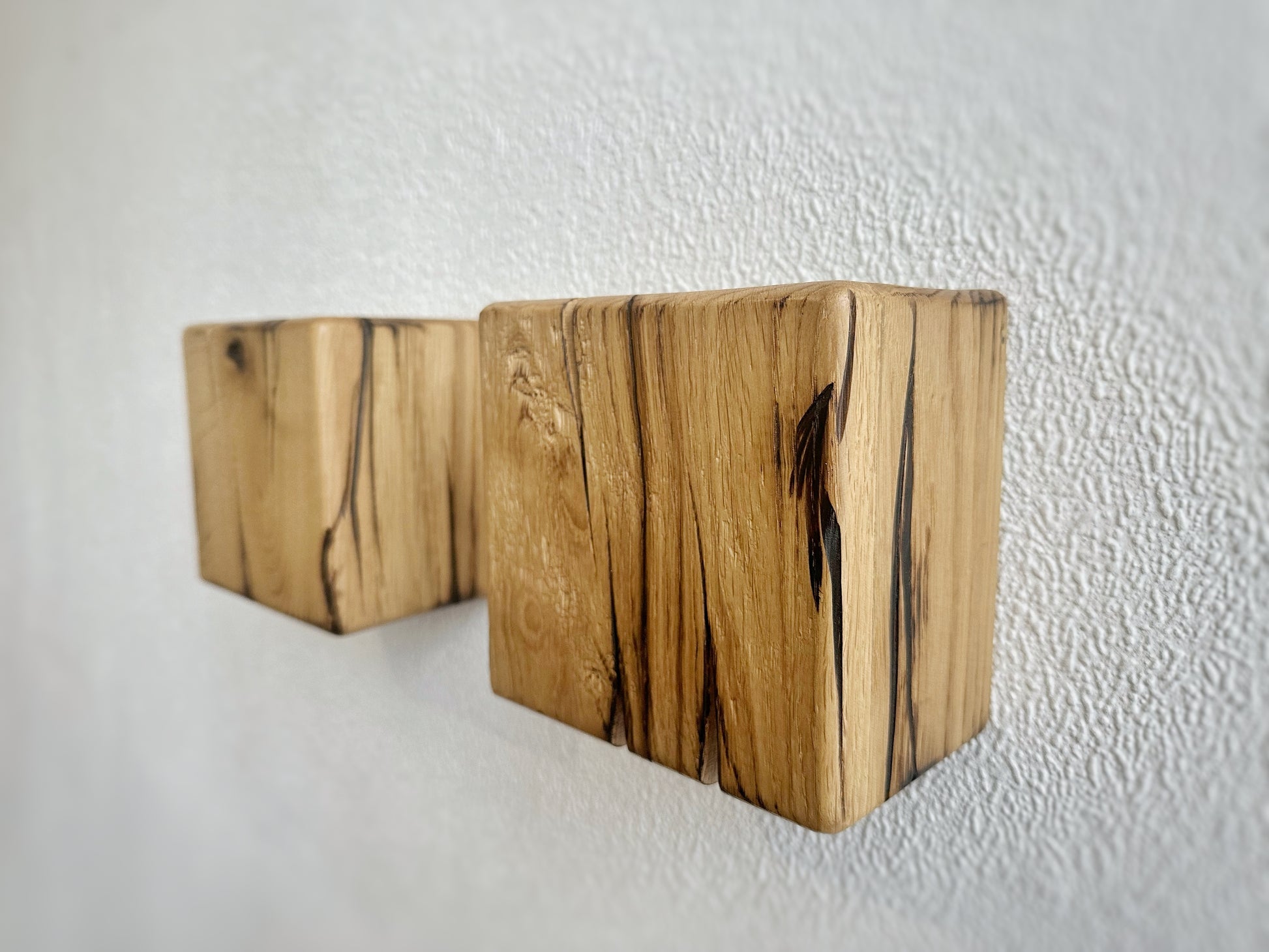 Modern rustic oak wood wall lights casting up and down light