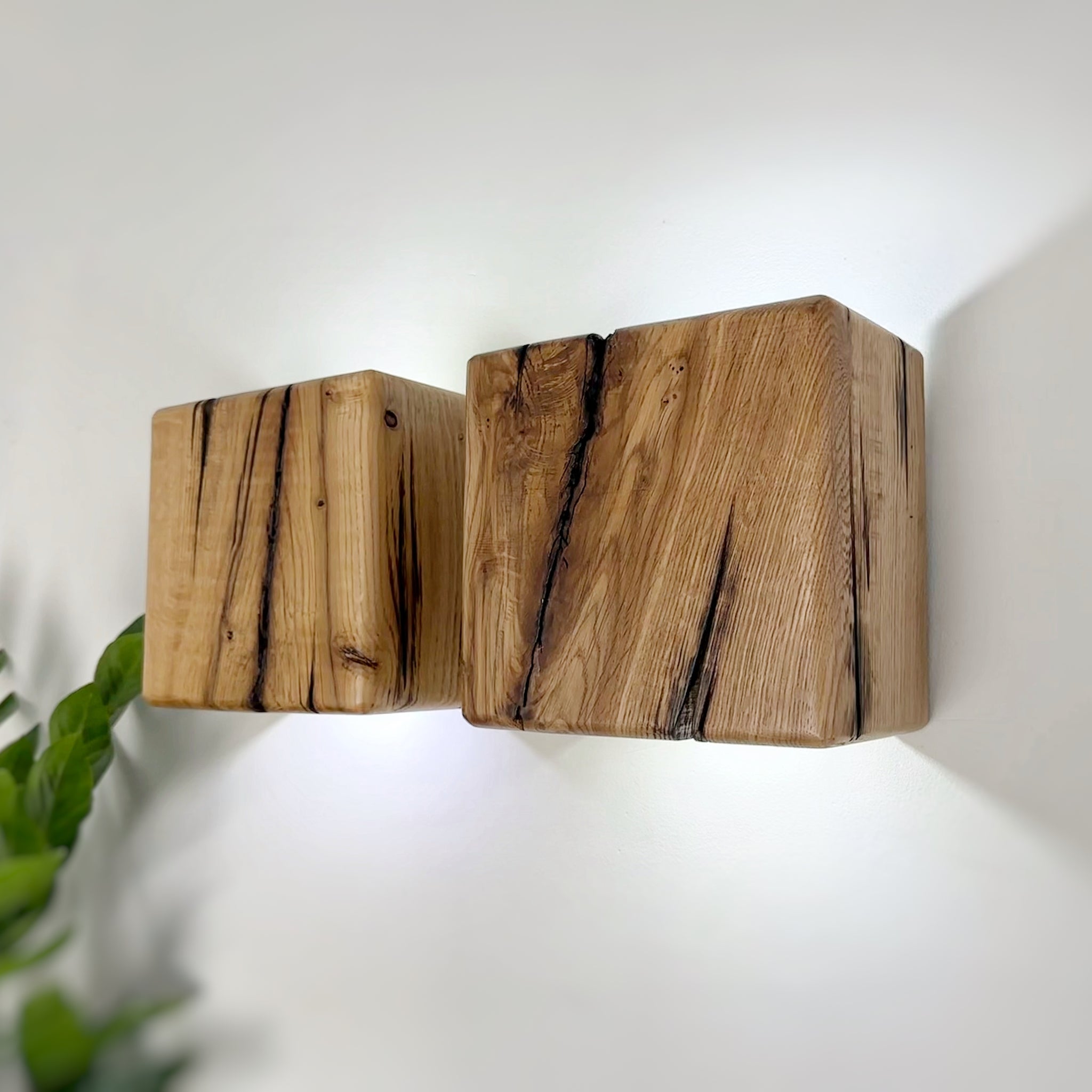 Modern rustic oak wood wall lights casting up and down light